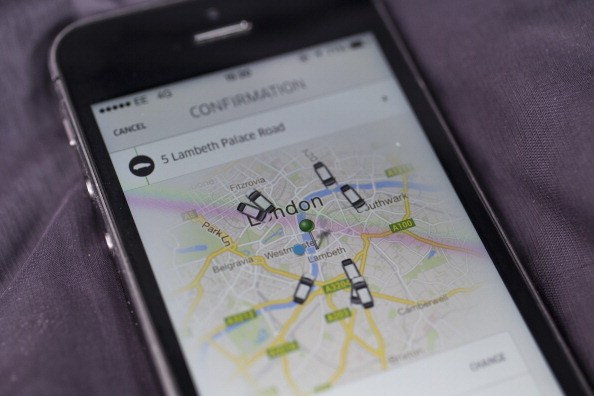 LONDON, ENGLAND - JUNE 02: In this photo illustration, a smartphone displays the 'Uber' mobile application which allows users to hail private-hire cars from any location on June 2, 2014 in London, England. The controversial piece of software, which is opposed by established taxi drivers, currently serves more than 100 cities in 37 countries. London's black cabs are seeking a High Court ruling on the claim that the Uber software is breaking the law by using an app as a taxi meter to determine rates.  (Photo by Oli Scarff/Getty Images)