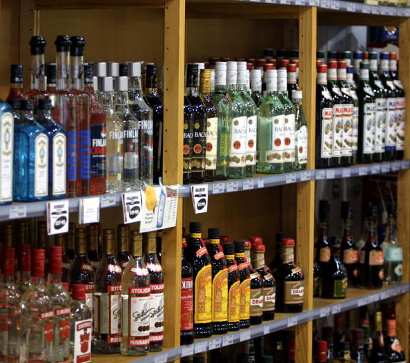 A line of spirits bottles at a local alcohol shop.