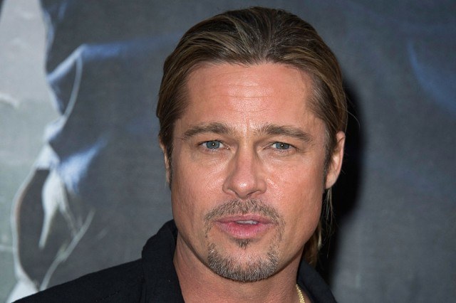 PARIS, FRANCE - JUNE 03: Brad Pitt a poses as he arrives for the Paris premiere of "World War Z" at Cinema UGC Normandie on June 3, 2013 in Paris, France. (Photo by Pascal Le Segretain/Getty Images For Paramount)