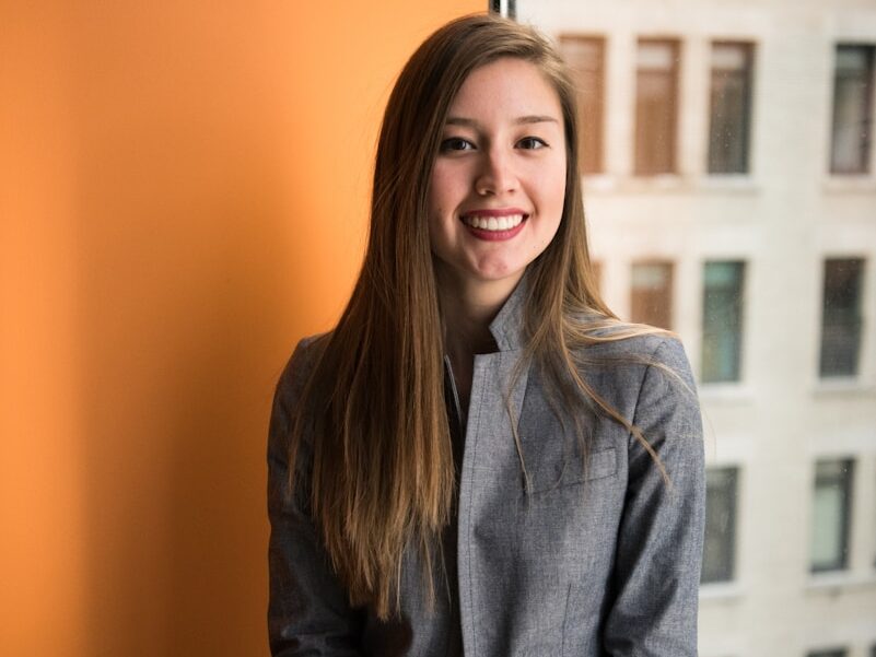 shallow focus photo of woman in gray jacket