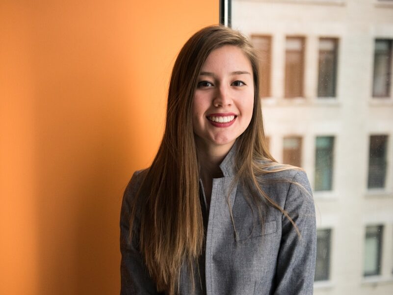 shallow focus photo of woman in gray jacket