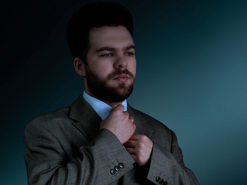 man in gray suit jacket