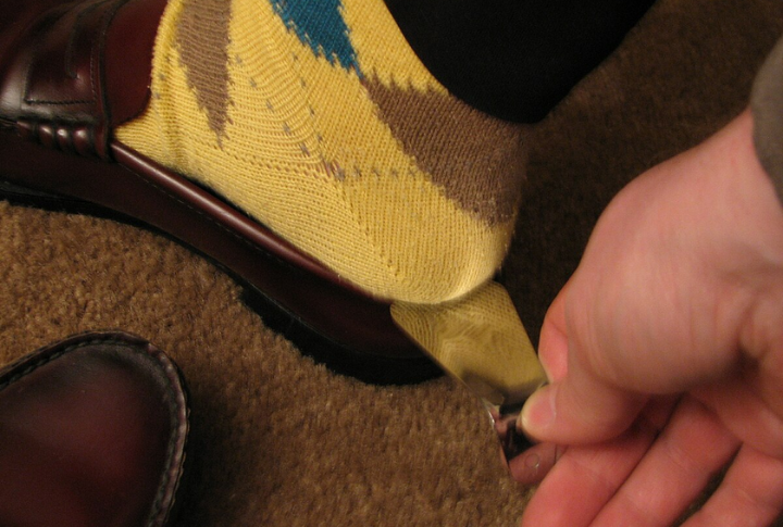 A Polished Shoe Rack With A Shoehorn