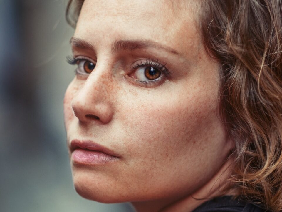 portrait photography of woman wearing black top