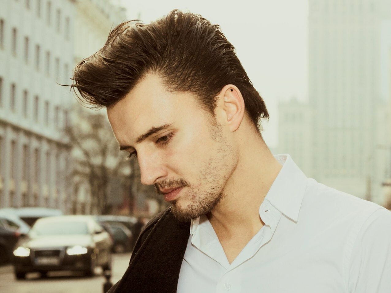 a man in a white shirt and a black jacket