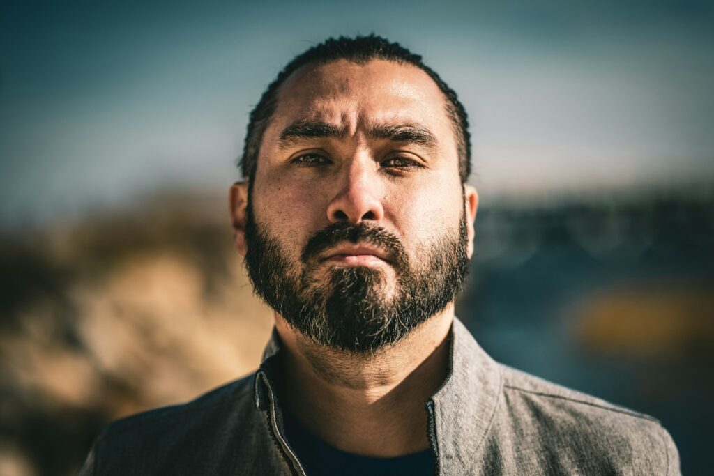 a close up of a man with a beard