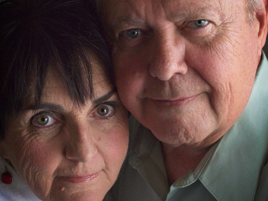 a man and woman taking a selfie