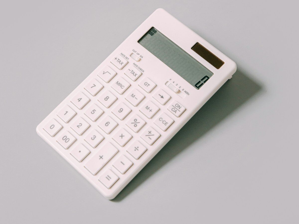 white calculator on white table