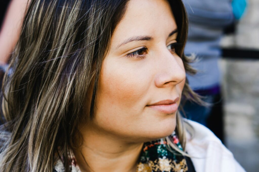 woman wearing scarf near standing person