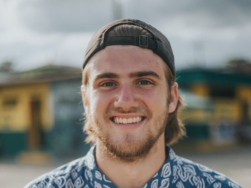 person wearing blue top smiling