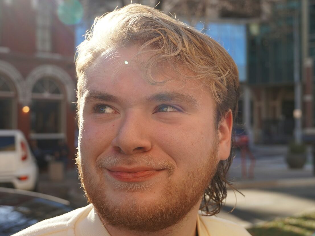 a close up of a person near a street