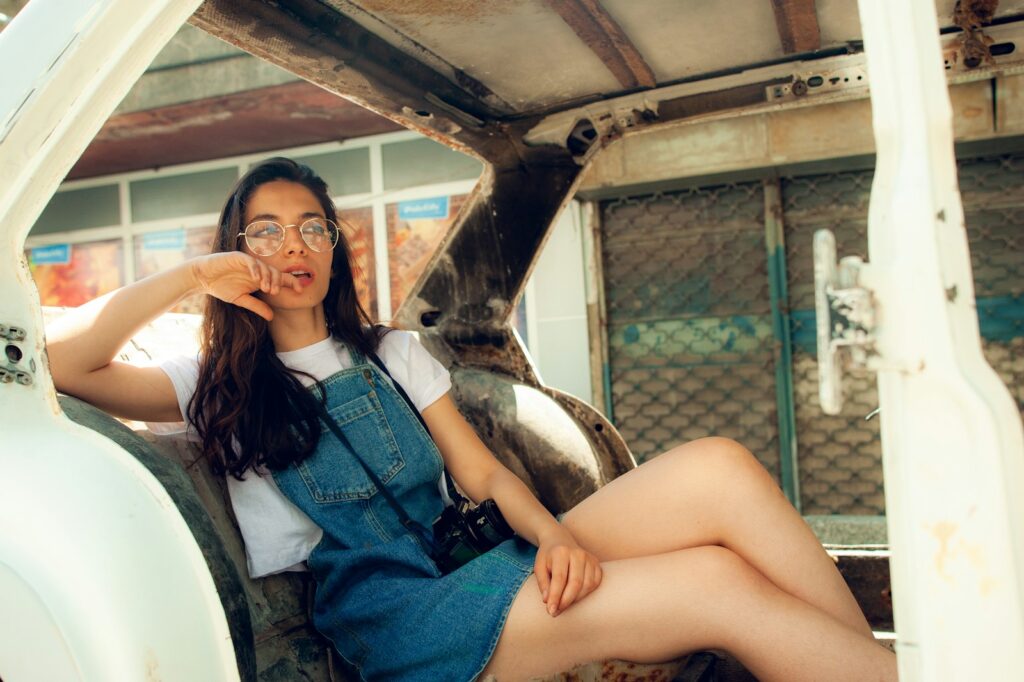 A woman sitting in the back of a truck