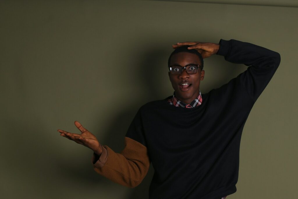 a man wearing glasses and a black shirt
