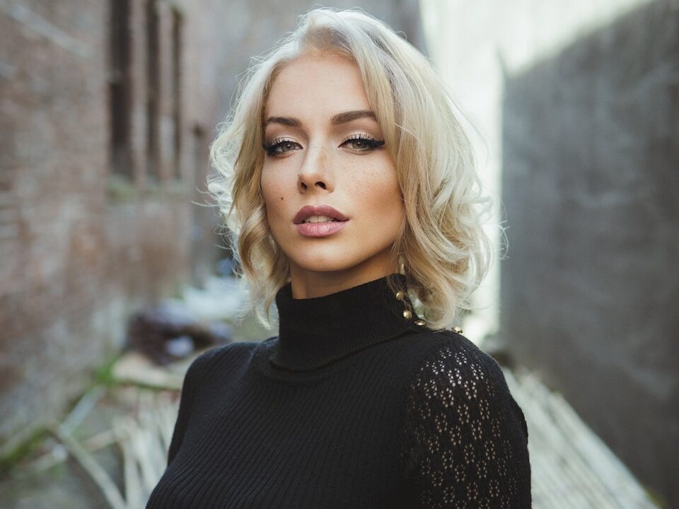 a woman standing in front of a building