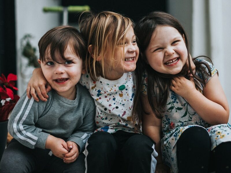 2 girls sitting on floor