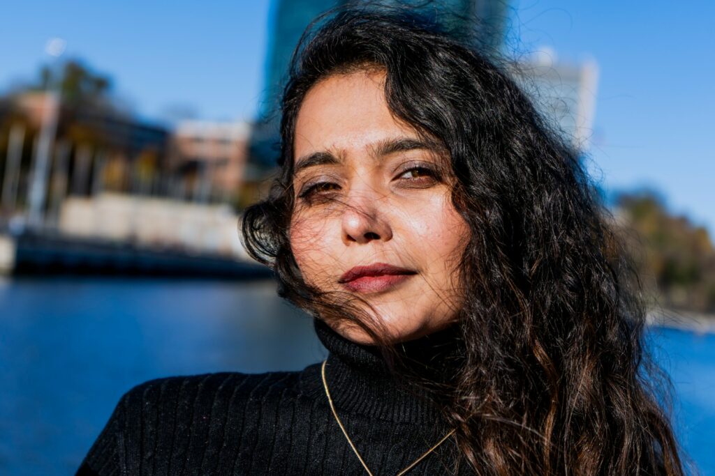 a close up of a person near a body of water