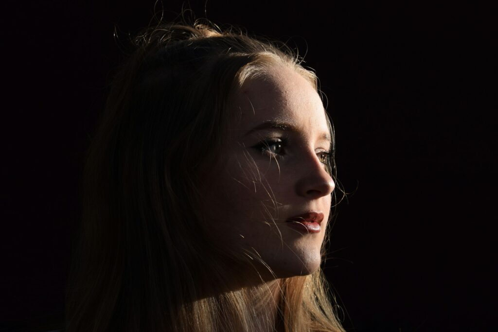 woman with brown hair and black eyes