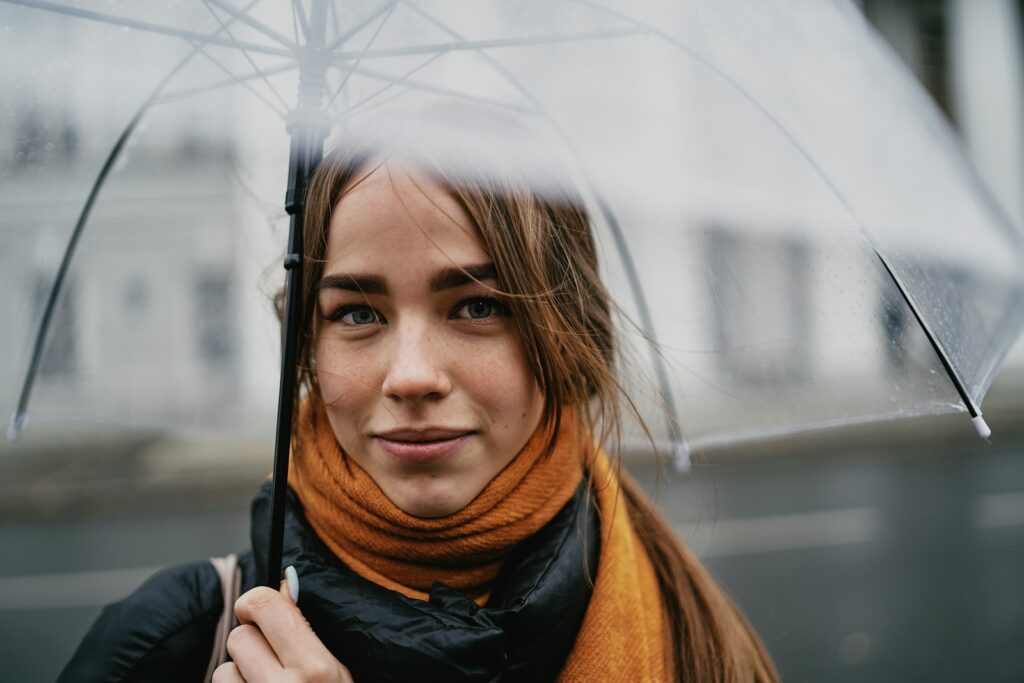 a woman holding an umbrella in the rain