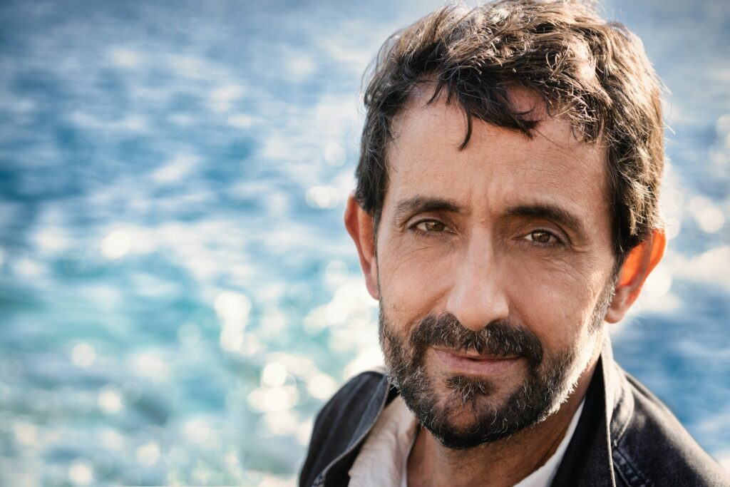 man in black jacket near body of water during daytime