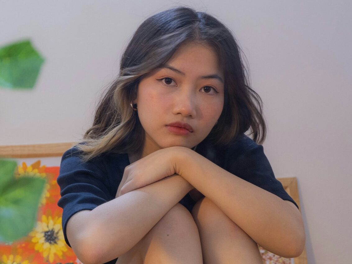 woman in blue long sleeve shirt