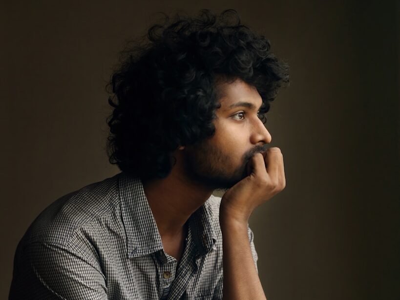 man in gray and white checkered dress shirt