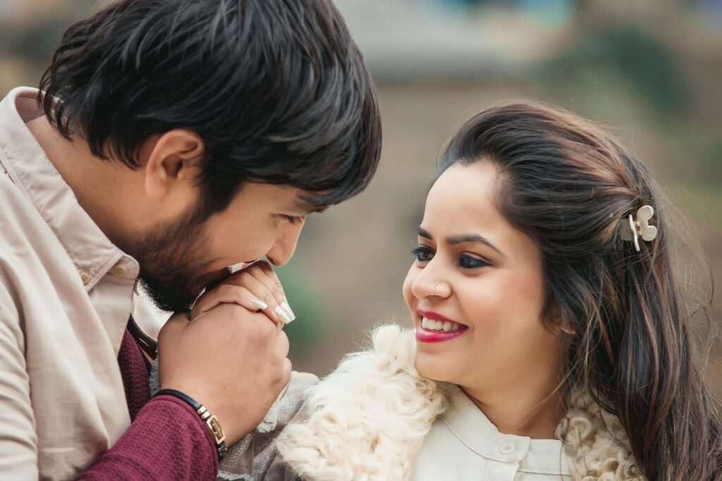 A loving couple in Kullu, India shares a tender moment outdoors.