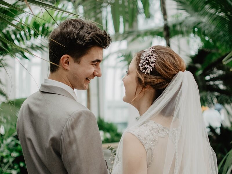 bride and groom surrounded by plants