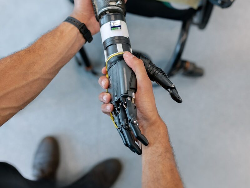 person holding black and silver tube