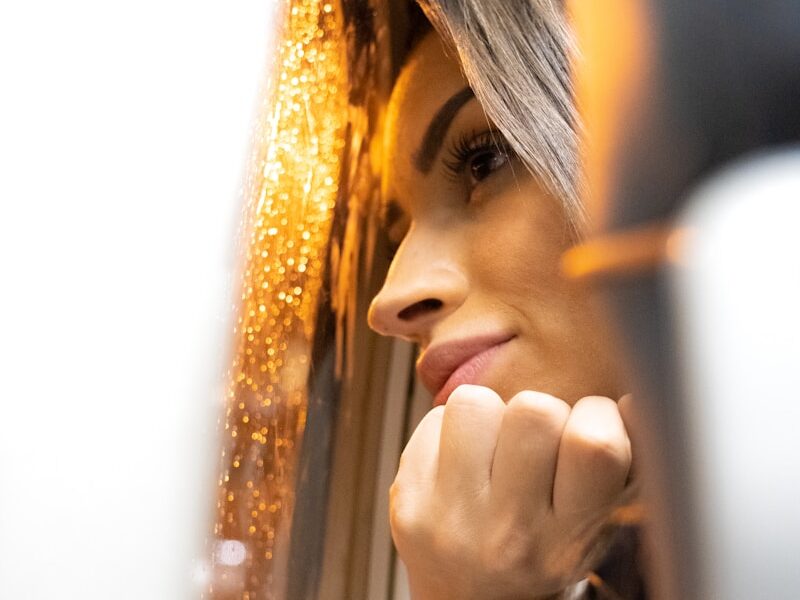 woman looking at window
