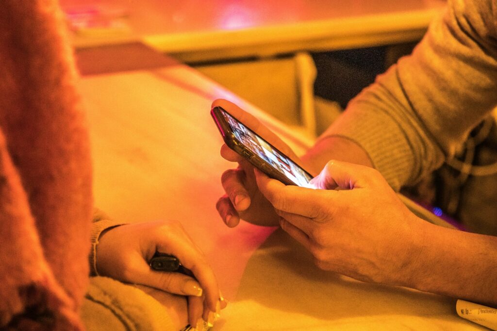 person holding silver iphone 6