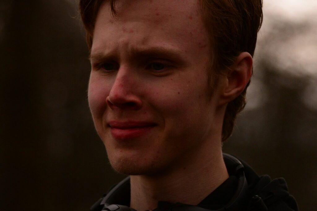 man in black and white collared shirt