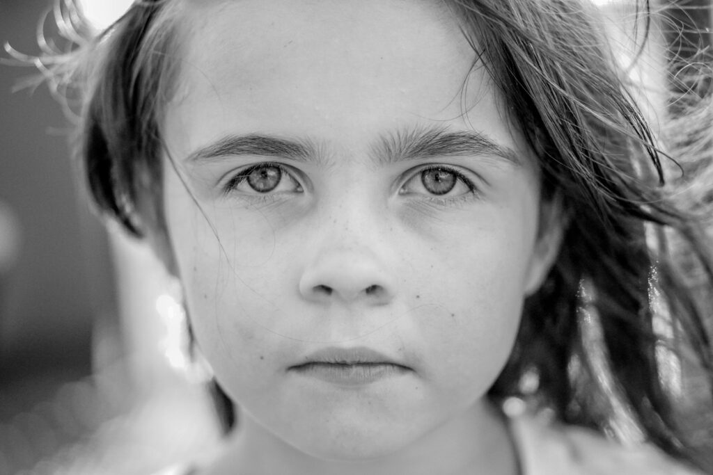 grayscale photo of girls face