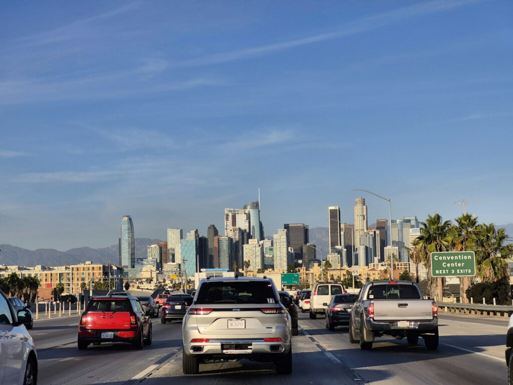A group of cars that are driving down a street