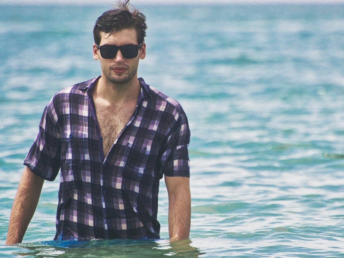 man standing on body of water during daytime
