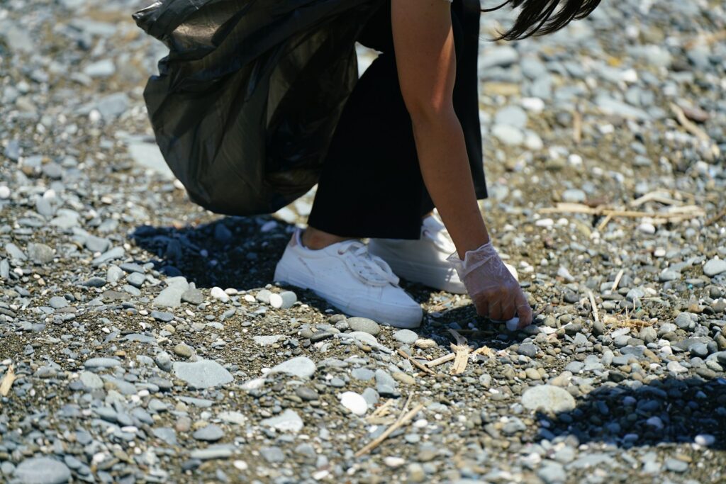 a person's legs and feet in the sand