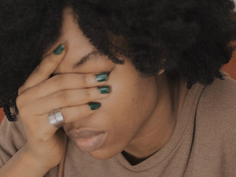 woman in brown crew neck shirt