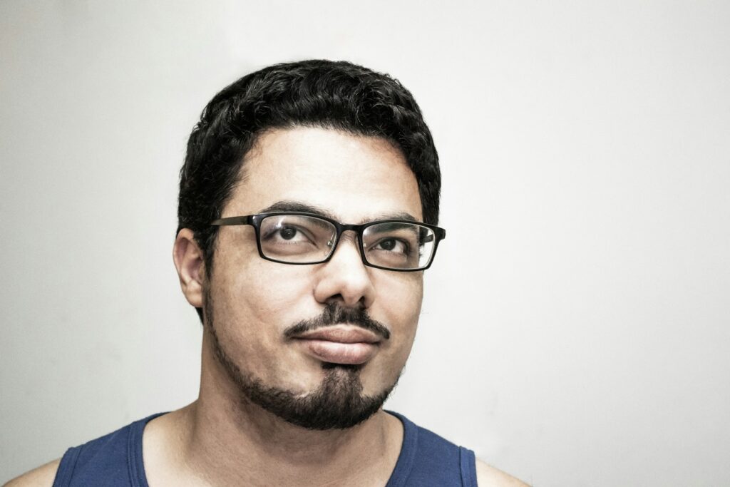 man in blue tank top