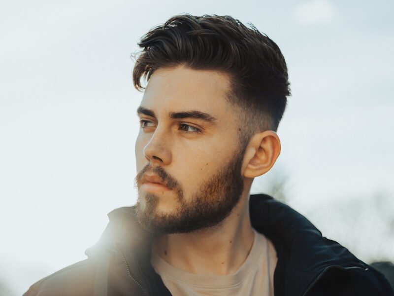 man in black zip up jacket