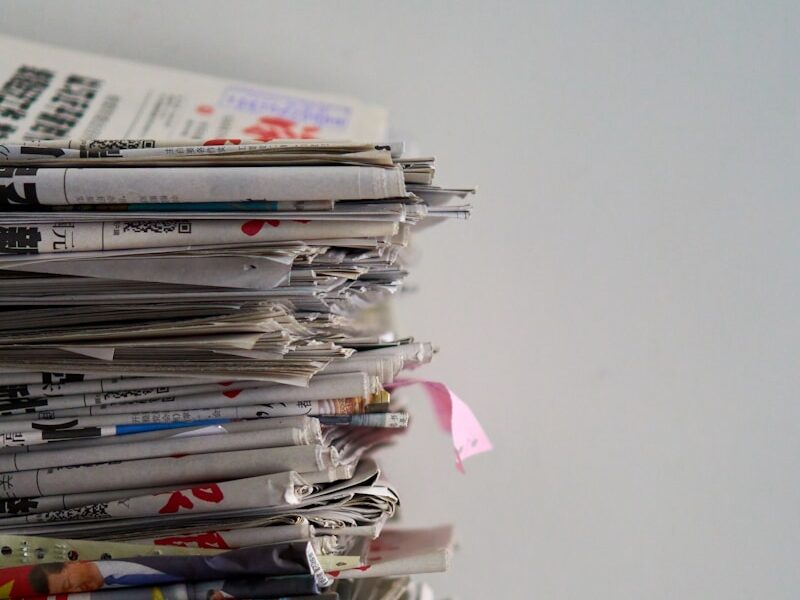 assorted newspapers on top of table