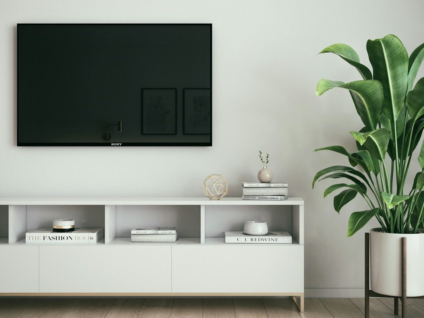 black flat screen tv on white wall
