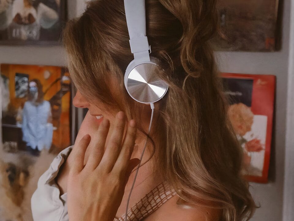 a woman wearing headphones in a room
