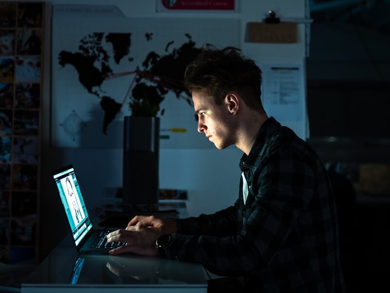 man sitting in front of a computer