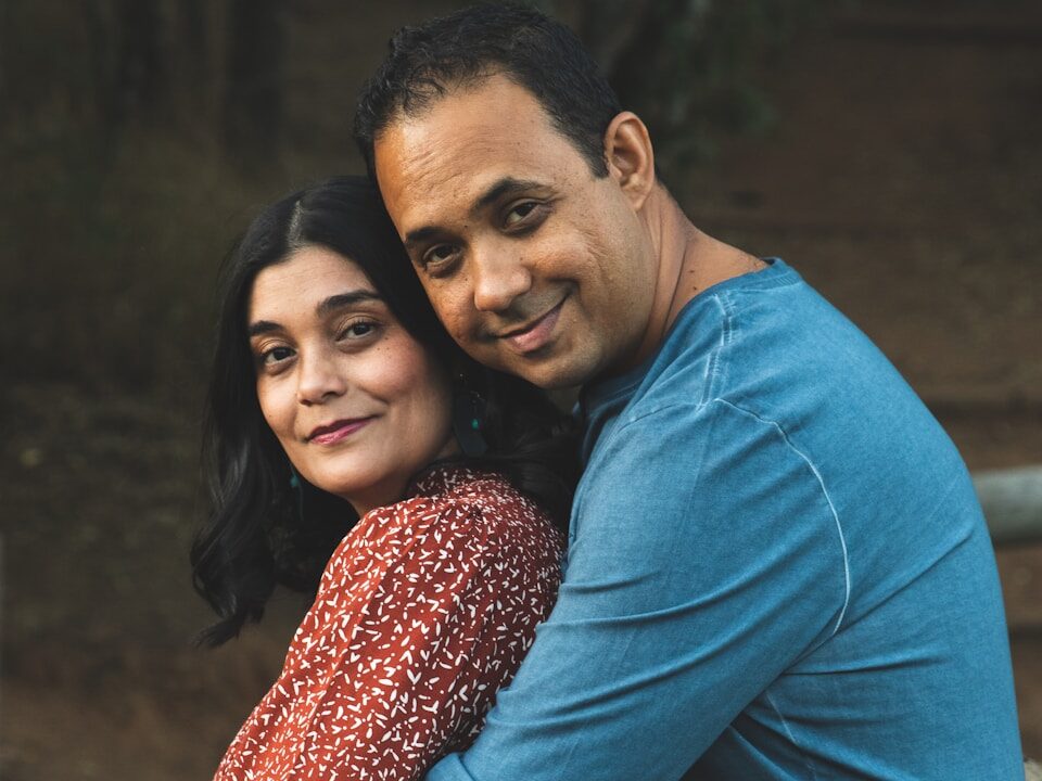 a man and a woman hugging each other