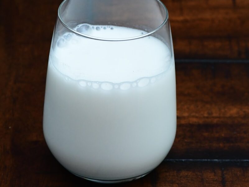 clear drinking glass with white liquid