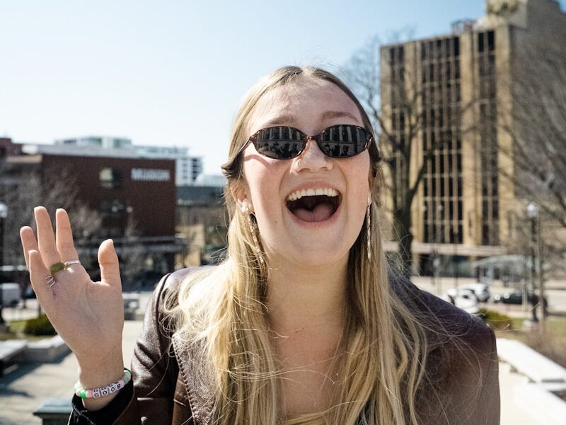 woman in brown sunglasses and brown shirt