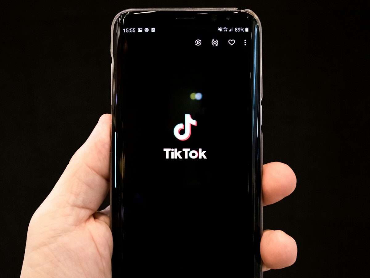 black android smartphone displaying 12 00