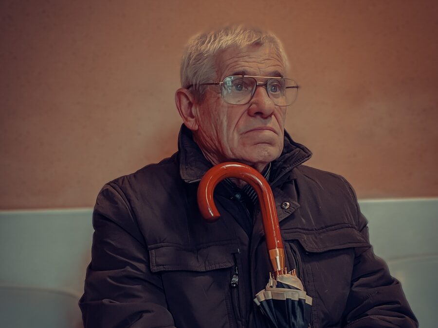 man in black jacket wearing eyeglasses