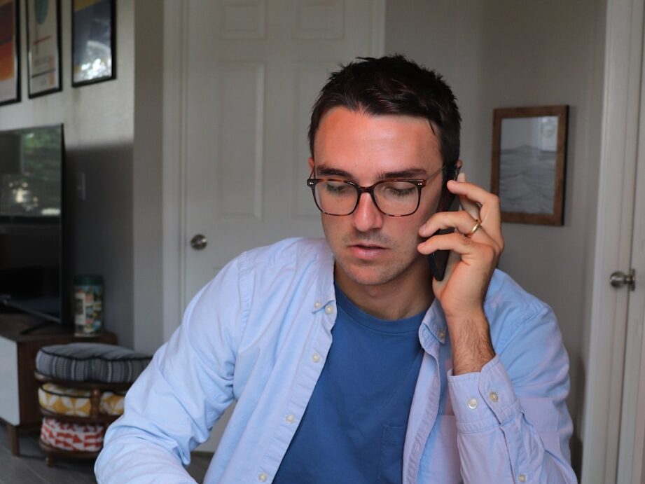 woman in white long sleeve shirt wearing eyeglasses