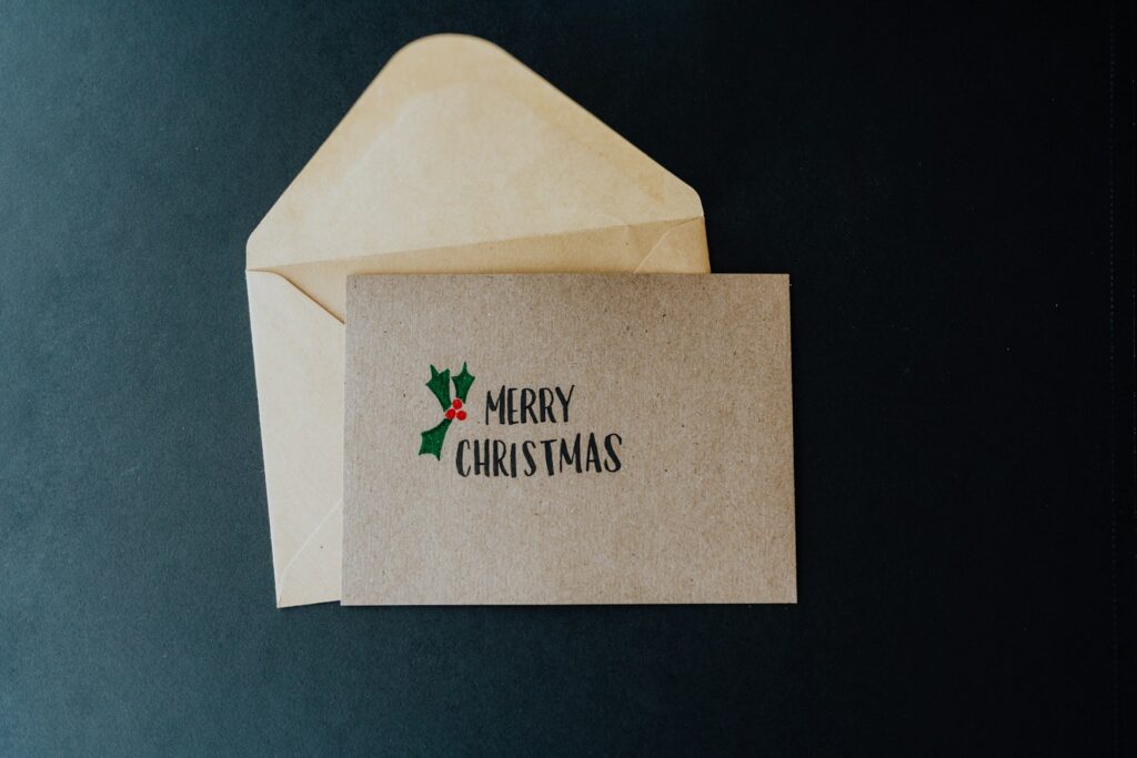 A white envelope with a merry christmas message on it