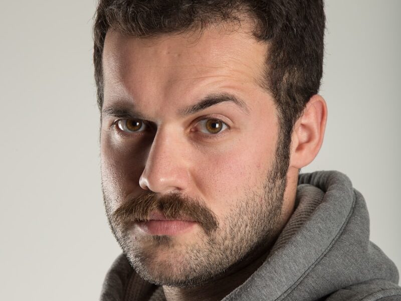 man in gray zip up hoodie